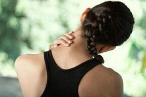 The girl is worried about the symptoms of cervical osteochondrosis
